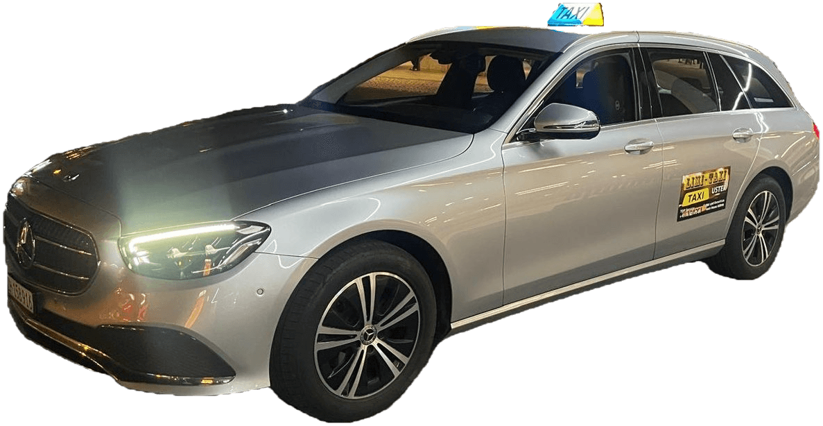 Silberner Mercedes-Benz E-Klasse Kombi von Limi Taxi mit leuchtendem Taxischild, bei Nacht